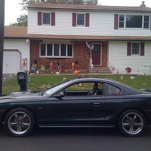 18 inch deep dish bullit wheels and a Saleen S281 rear spoiler.