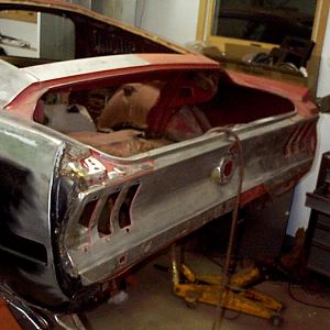 part way through process of taking all exterior down to bare steel.