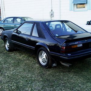 this side took the most damage in the barn collapse . note the replacement fender and dent in the rear quarter