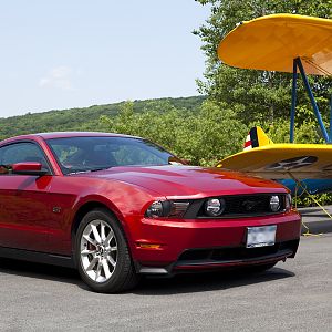 Mustang and biplane