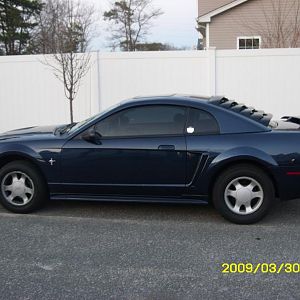 Side view of the louvers and bigger profile tires on the back!