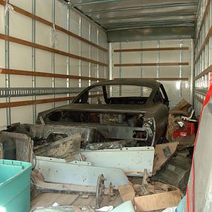 moving truck full of mustang and parts