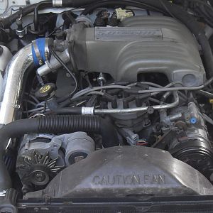 that cold air intake is gone. I wanted it original and bought the air bx and K&N filter...will post new pics later