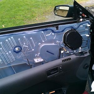 Tearing apart the doors to put in new speakers.