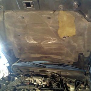 Hood Insulator...before...factory fasteners smaller, insulator tattered and torn.