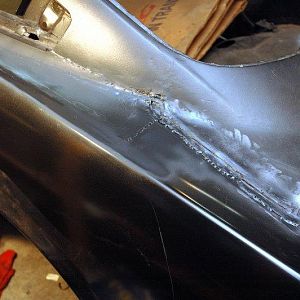 Left Side Quarter - New quarter welded and ground. I wish I had replaced the full quarter with vent because of the layers of old, bad repairs.