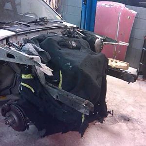 The fender aprons were wrinkled from a previous accident and the radiator support was bent badly not to mention it wasn't even welded to the frame rai