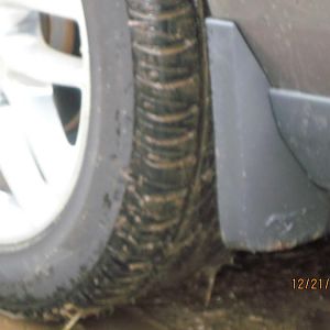Close-up of rear mud guards with pony logo