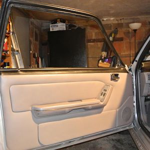 Sooo... went ahead and painted entire door card and panels with SEM paint after prep.  Also painted dash vent to get the right color (match) back.