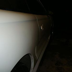 Passenger side, small ding above rear quarter and in center of pass. door