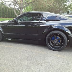 Blue Calipers Behind Black Rims