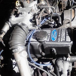 Finished engine , Degreased the valve cover stripped and repainted along with the header and water return lines.