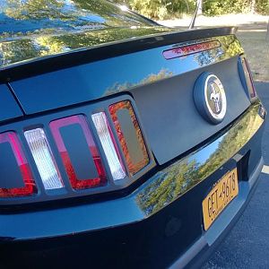 Rear end cosmetic mods are finally done. MMD taillight trim, AM vinyl overlays, and Plasti Dip on the decklid and outer ring of the faux gas cap!