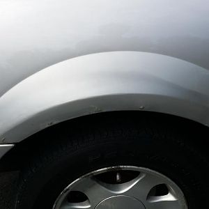 Fiberglass, bondo and aerosol overhaul by dealer. Body shop will correct it all.