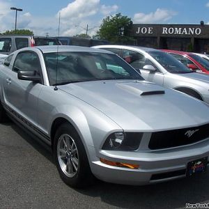Dealership photo for my 2005 Mustang V6 Coupe.  Imagine my surprise when reading the description it only had 11,900 miles on it.  The previous owner d