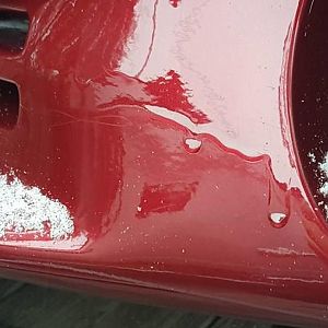 Runs in paint left side and orange peel