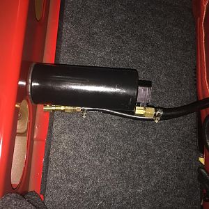 Trunk mounted differential oil breather can.  Pic is sideways? Wth?  Bought a cheap universal can off eBay, ran tubing to axle breather vent. Replaced